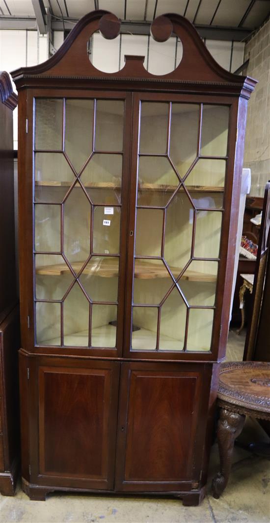 A George III mahogany standing corner display cabinet